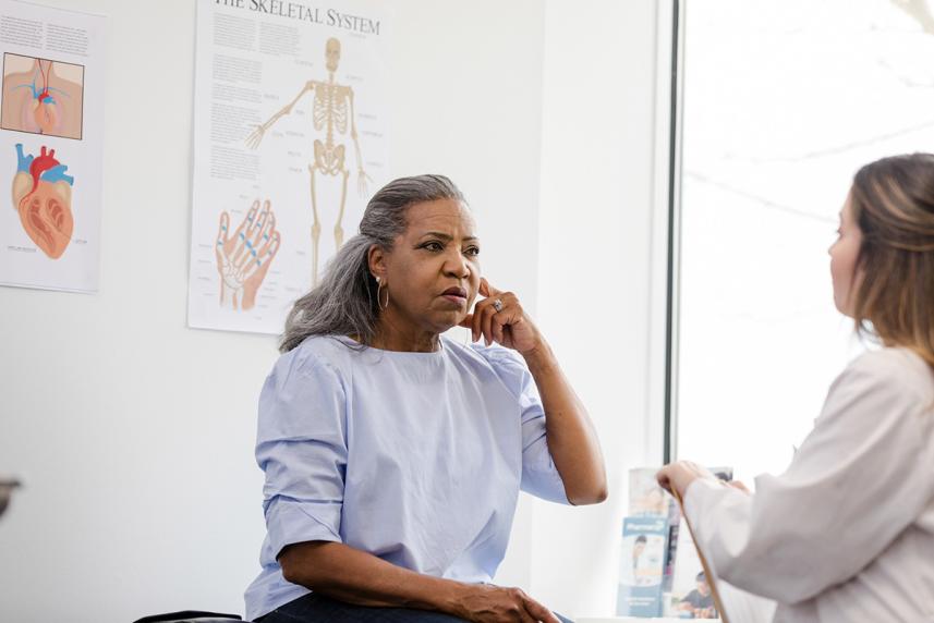 A woman talking to a doctor